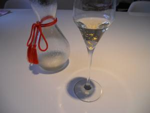 Gold sake in flute glass